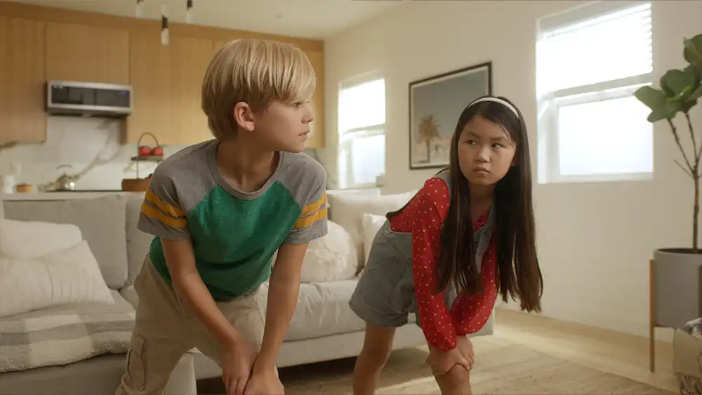 Family playing Miraculous Ladybug game on NEX Playground console, part of a strategic brand campaign developed by Evolution, an integrated marketing and content studio.