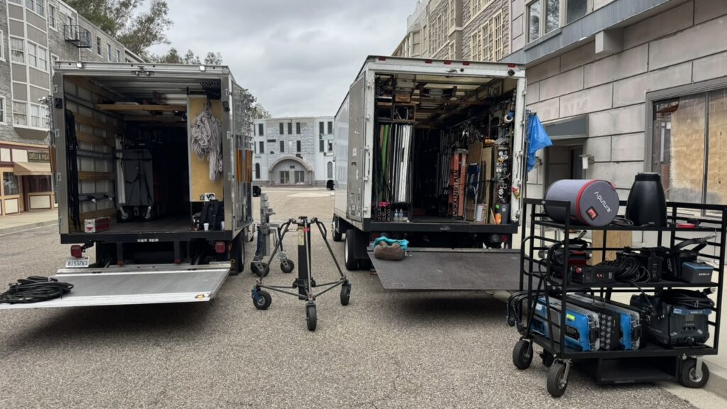 Evolution camera crew and director setting up a sports marketing campaign commercial shoot using advanced camera lenses